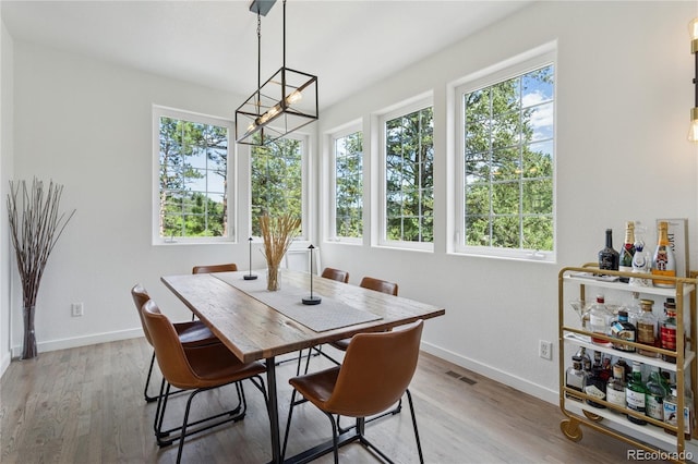 4978 Camel Heights Rd, Evergreen, CO 80439 - dining space with a chandelier and light wood-type flooring
