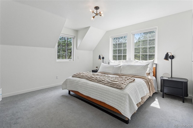4978 Camel Heights Rd, Evergreen, CO 80439 - carpeted bedroom featuring vaulted ceiling and a chandelier