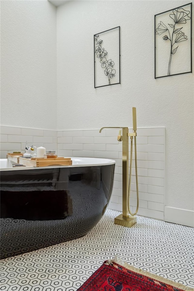 4978 Camel Heights Rd, Evergreen, CO 80439 - bathroom featuring tile walls and tile patterned flooring