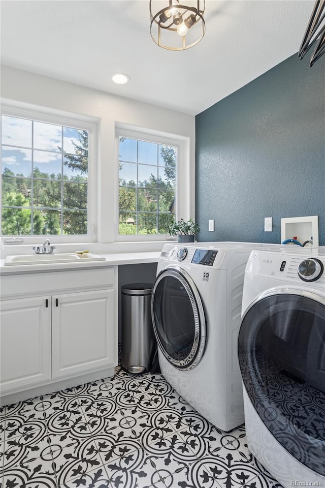 4978 Camel Heights Rd, Evergreen, CO 80439 - washroom with independent washer and dryer, cabinet space, and a textured wall