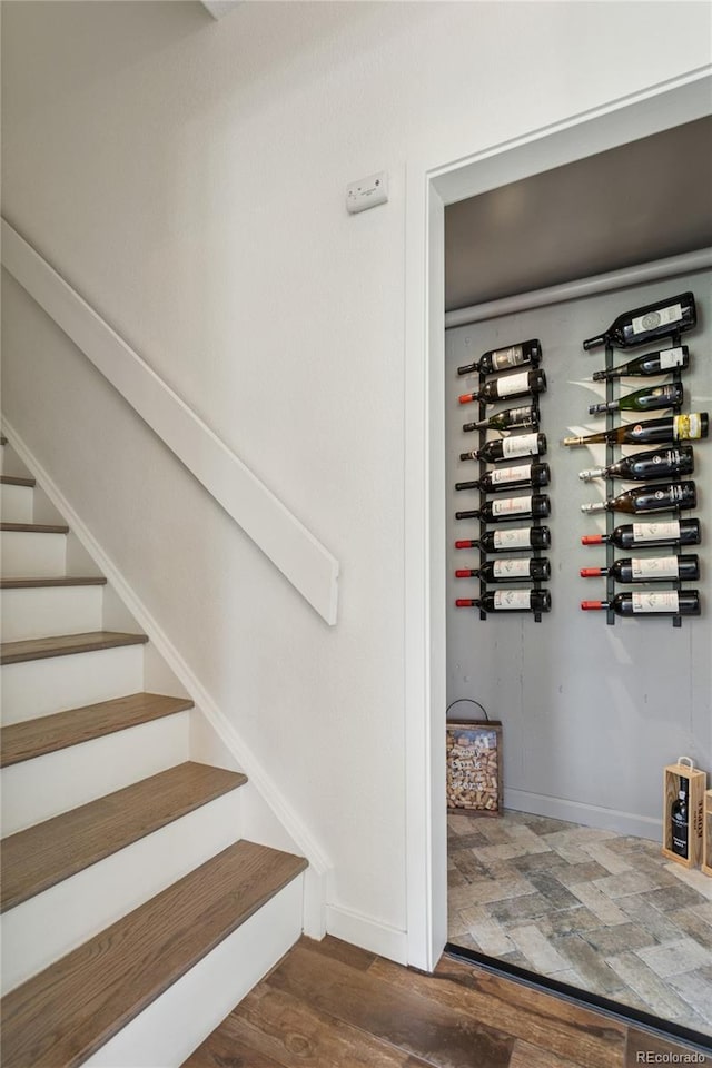 4978 Camel Heights Rd, Evergreen, CO 80439 - wine room with dark wood finished floors and baseboards