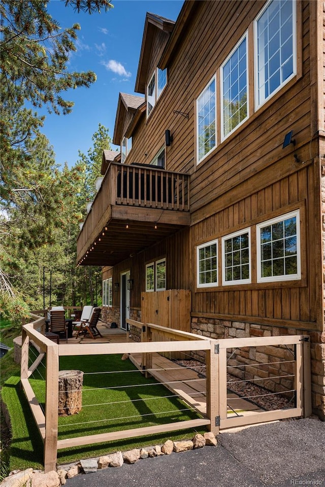4978 Camel Heights Rd, Evergreen, CO 80439 - rear view of house featuring a balcony