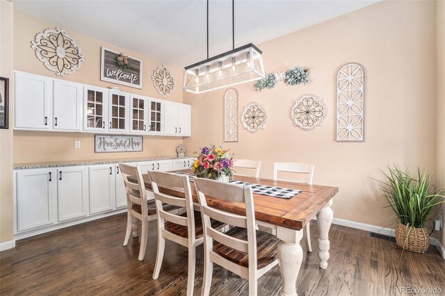2726 Aylesbury Way, Johnstown, CO 80534 - dining room with dark wood-style flooring and baseboards