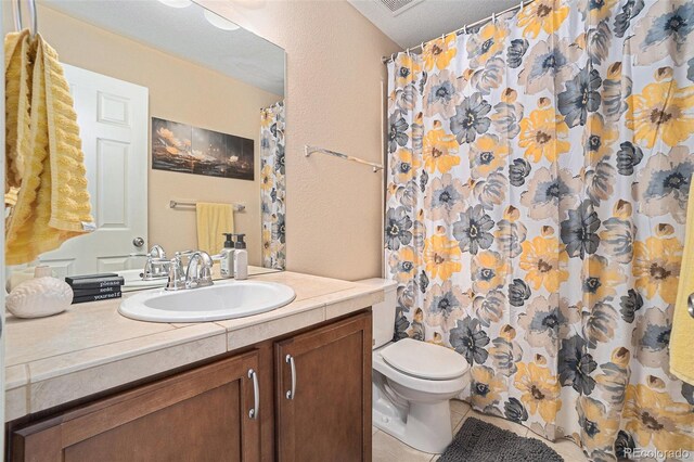 2726 Aylesbury Way, Johnstown, CO 80534 - full bathroom with vanity, toilet, tile patterned flooring, and a shower with curtain