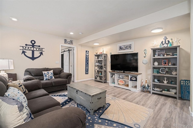 2726 Aylesbury Way, Johnstown, CO 80534 - living room featuring wood finished floors, recessed lighting, and baseboards