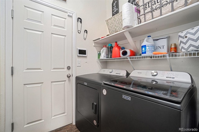 2726 Aylesbury Way, Johnstown, CO 80534 - washroom with washing machine and dryer and dark wood-type flooring
