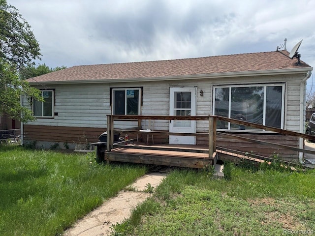 1105 S Raleigh St, Denver, CO 80219 - rear view of property featuring a deck