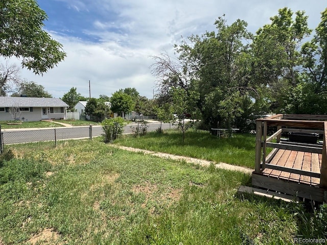 1105 S Raleigh St, Denver, CO 80219 - view of yard with a wooden deck