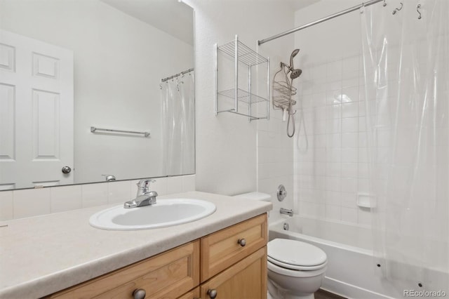 full bathroom featuring vanity, toilet, and shower / bath combination with curtain