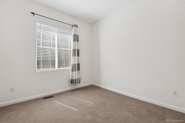 spare room with carpet floors