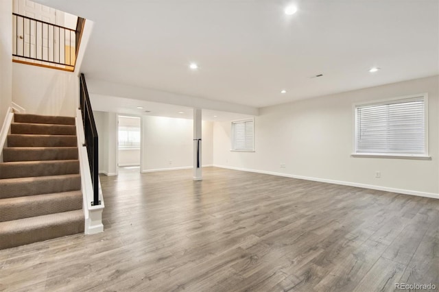 unfurnished living room with hardwood / wood-style flooring