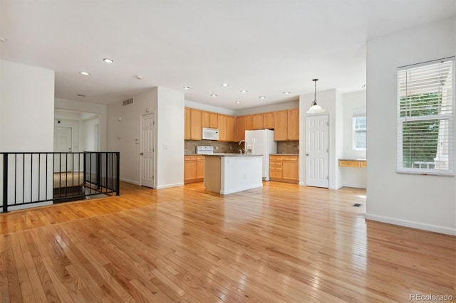 interior space with sink and light hardwood / wood-style flooring