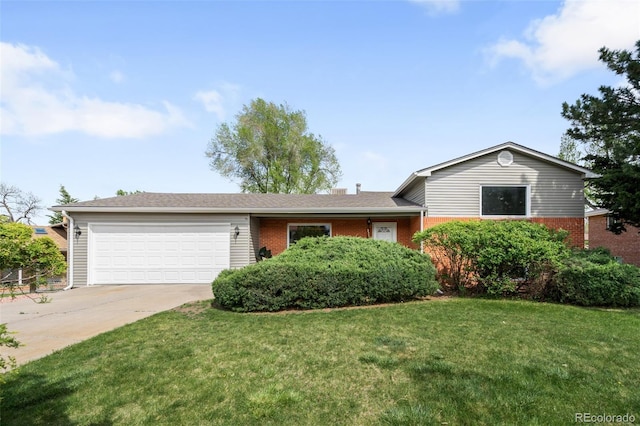view of front of house with a garage, driveway, a front yard, and brick siding