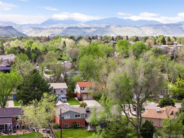 aerial view of residential area with a mountainous background