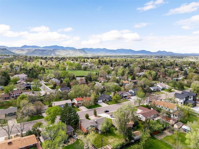 aerial view of residential area featuring a mountain backdrop