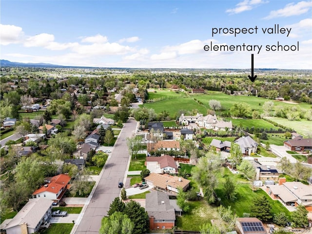 aerial view of property's location with nearby suburban area