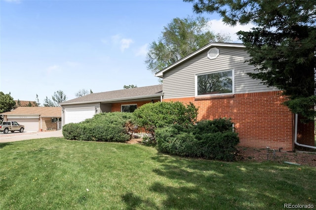 3322 Simms St, Wheat Ridge, CO 80033 - ranch-style house with brick siding, an attached garage, a front lawn, and driveway