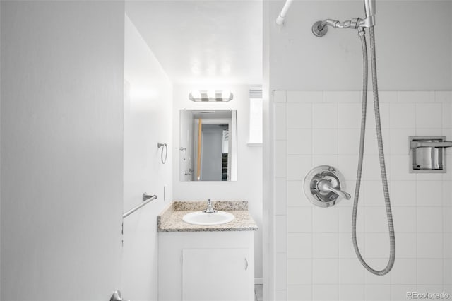 3322 Simms St, Wheat Ridge, CO 80033 - full bathroom with a tile shower and vanity