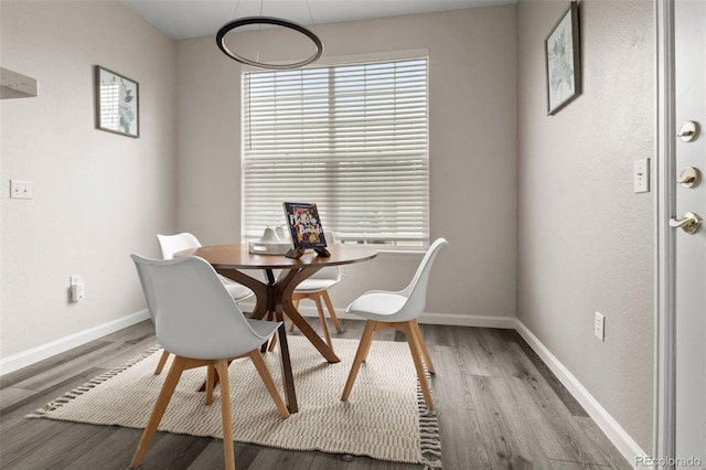 7440 S Blackhawk St Unit 2-108, Englewood, CO 80112 - dining space featuring wood finished floors and plenty of natural light