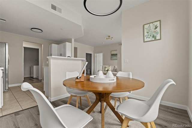 7440 S Blackhawk St Unit 2-108, Englewood, CO 80112 - dining room with light wood-style floors and baseboards