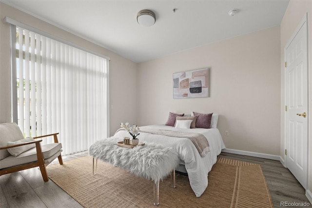 7440 S Blackhawk St Unit 2-108, Englewood, CO 80112 - bedroom with wood finished floors and baseboards