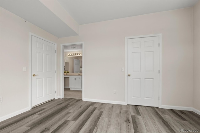 7440 S Blackhawk St Unit 2-108, Englewood, CO 80112 - unfurnished bedroom with wood finished floors