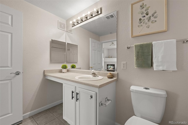 7440 S Blackhawk St Unit 2-108, Englewood, CO 80112 - half bathroom with vanity and tile patterned flooring