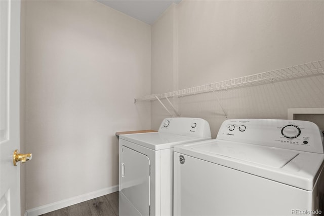7440 S Blackhawk St Unit 2-108, Englewood, CO 80112 - washroom with separate washer and dryer and dark wood-style flooring