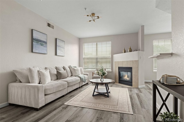 7440 S Blackhawk St Unit 2-108, Englewood, CO 80112 - living room with wood finished floors and a fireplace