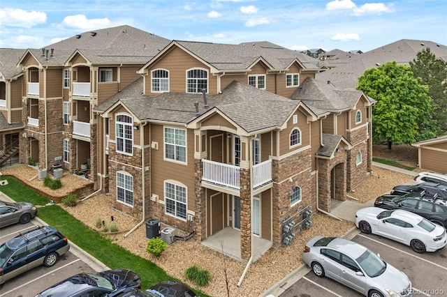 7440 S Blackhawk St Unit 2-108, Englewood, CO 80112 - view of building exterior featuring uncovered parking and a residential view