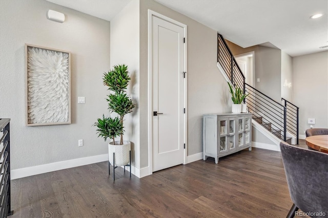 stairs featuring hardwood / wood-style flooring