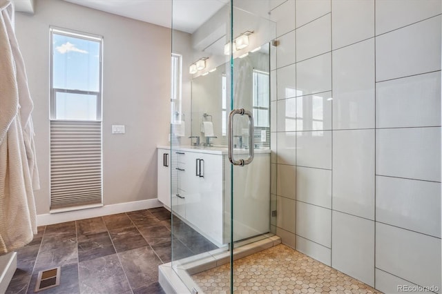 bathroom with a shower with shower door