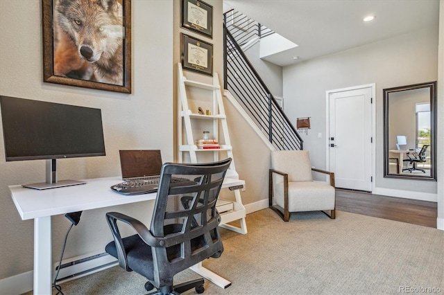 home office featuring carpet floors and baseboard heating