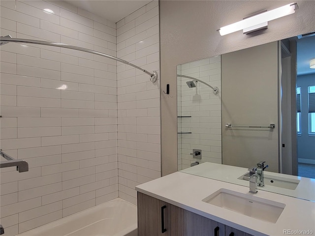 bathroom with vanity and tiled shower / bath combo