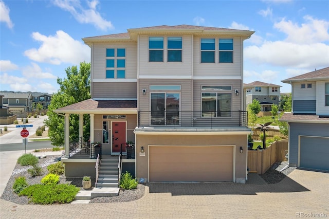 2999 Merry Rest Way, Castle Rock, CO 80109 - view of front facade with an attached garage, driveway, covered porch, and a residential view