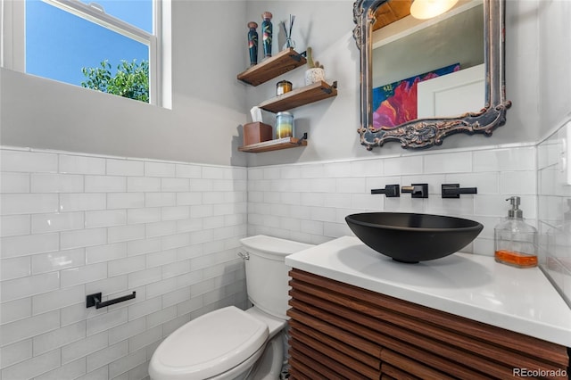 2999 Merry Rest Way, Castle Rock, CO 80109 - half bath with vanity, tile walls, and a wainscoted wall