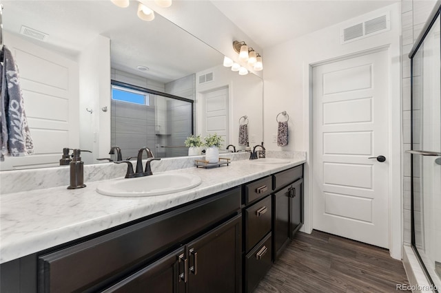 2999 Merry Rest Way, Castle Rock, CO 80109 - full bathroom with double vanity, a stall shower, and wood finished floors