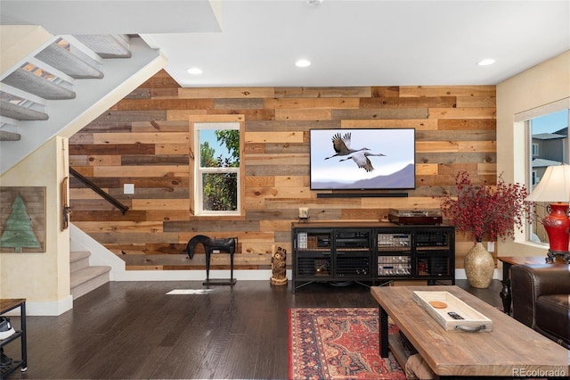2999 Merry Rest Way, Castle Rock, CO 80109 - living area with wood walls, stairs, wood finished floors, and recessed lighting