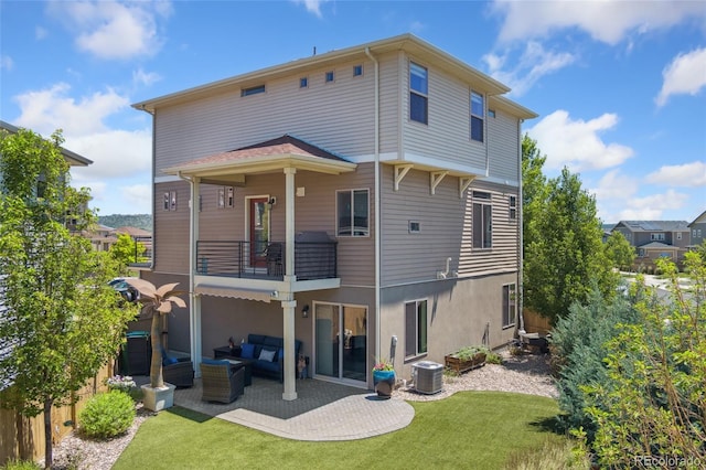 2999 Merry Rest Way, Castle Rock, CO 80109 - rear view of property featuring a balcony, an outdoor living space, a lawn, a patio, and stucco siding