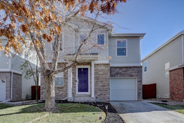 traditional-style home with a garage, brick siding, concrete driveway, and a front lawn