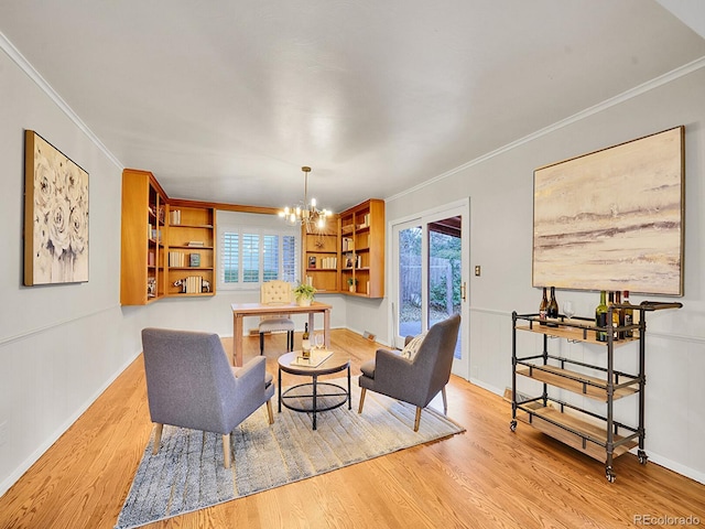 living room with plenty of natural light, an inviting chandelier, crown molding, and light hardwood / wood-style flooring