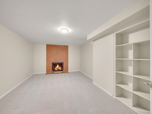 unfurnished living room featuring light carpet and a fireplace