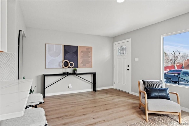 interior space with light wood-style flooring and baseboards