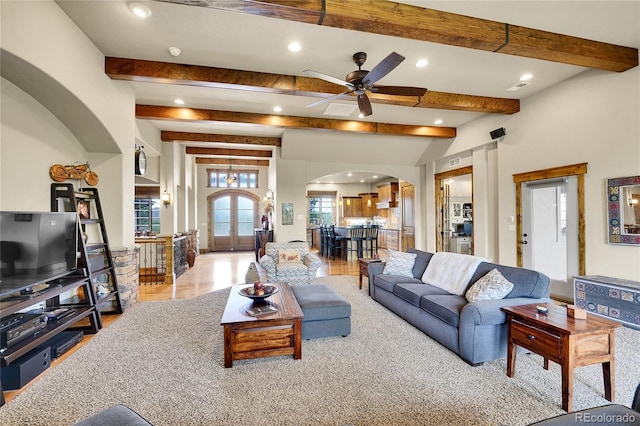 6349 Southridge Greens Blvd, Fort Collins, CO 80525 - living area featuring arched walkways, recessed lighting, beam ceiling, french doors, and ceiling fan