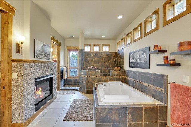 6349 Southridge Greens Blvd, Fort Collins, CO 80525 - bathroom with a garden tub, tile patterned flooring, recessed lighting, and a fireplace