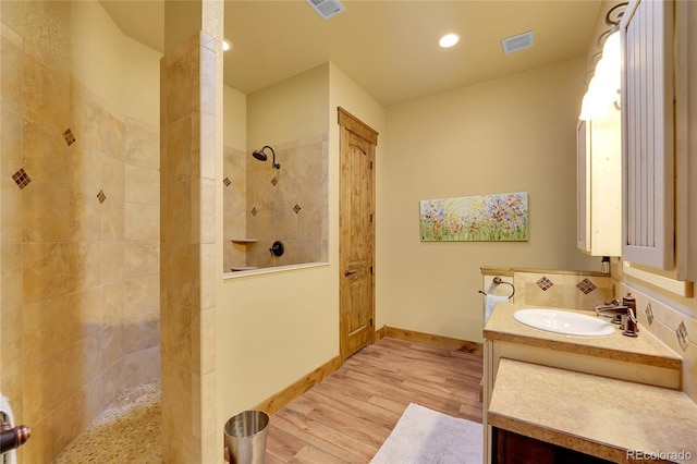 6349 Southridge Greens Blvd, Fort Collins, CO 80525 - full bath with wood finished floors, walk in shower, vanity, baseboards, and recessed lighting