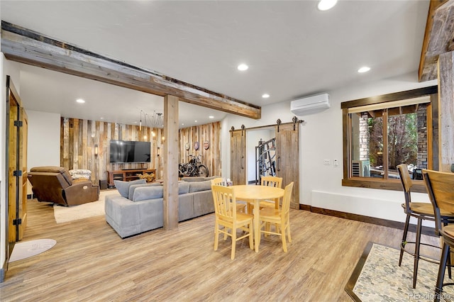 6349 Southridge Greens Blvd, Fort Collins, CO 80525 - dining room featuring a barn door, light wood-type flooring, recessed lighting, baseboards, and beam ceiling