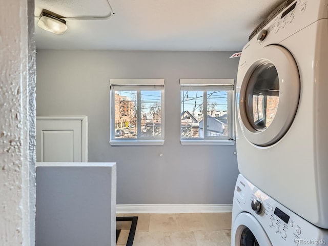 laundry area with stacked washer and dryer