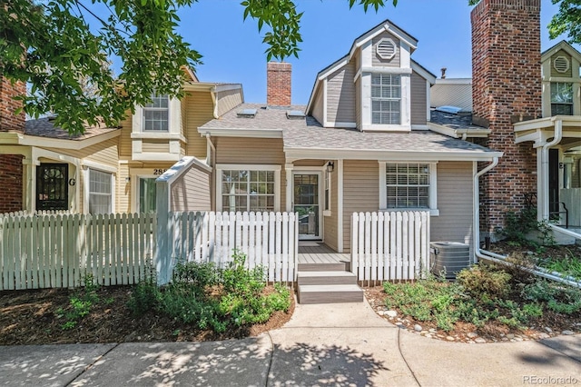 2881 W Long Dr Unit F, Littleton, CO 80120 - multi unit property with a porch and a shingled roof