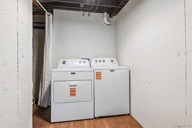 2881 W Long Dr Unit F, Littleton, CO 80120 - washroom with separate washer and dryer and light wood finished floors